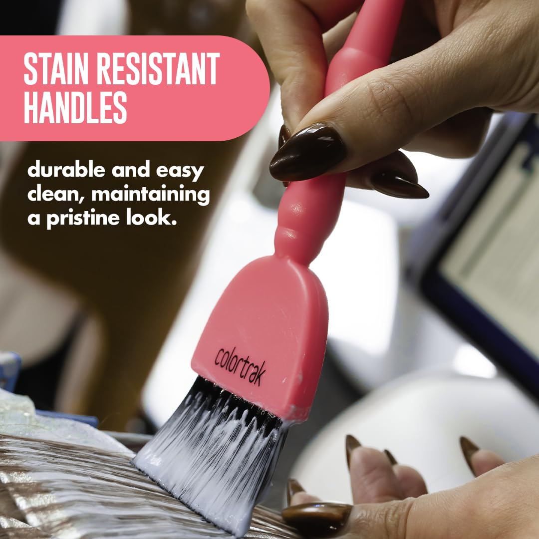 Professional stylist holding Colortrak electric hair color brush