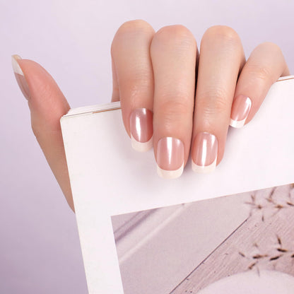 Application of semi cured gel nail strips under UV lamp