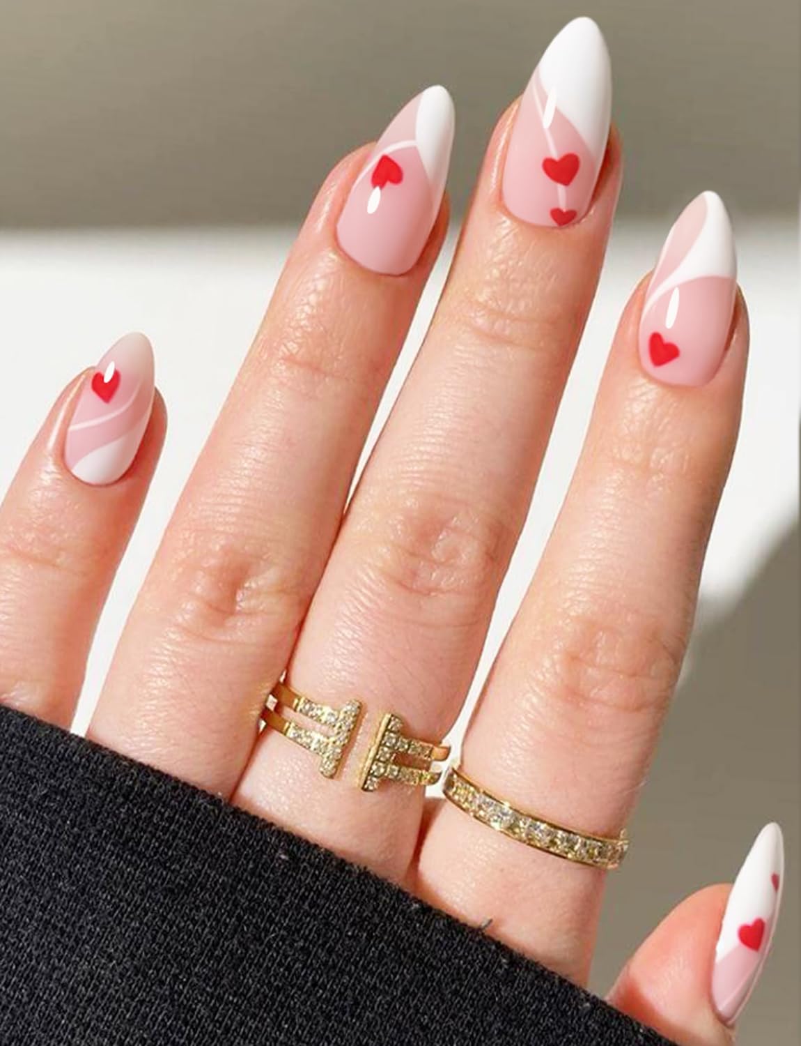 Model wearing Valentine style gel nail wraps on hand