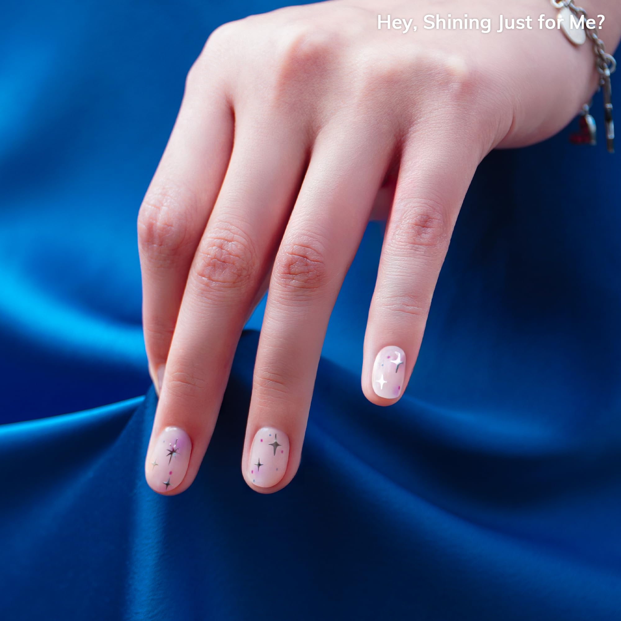 Close up of Heyhae pink aura gel nail strips on natural nails