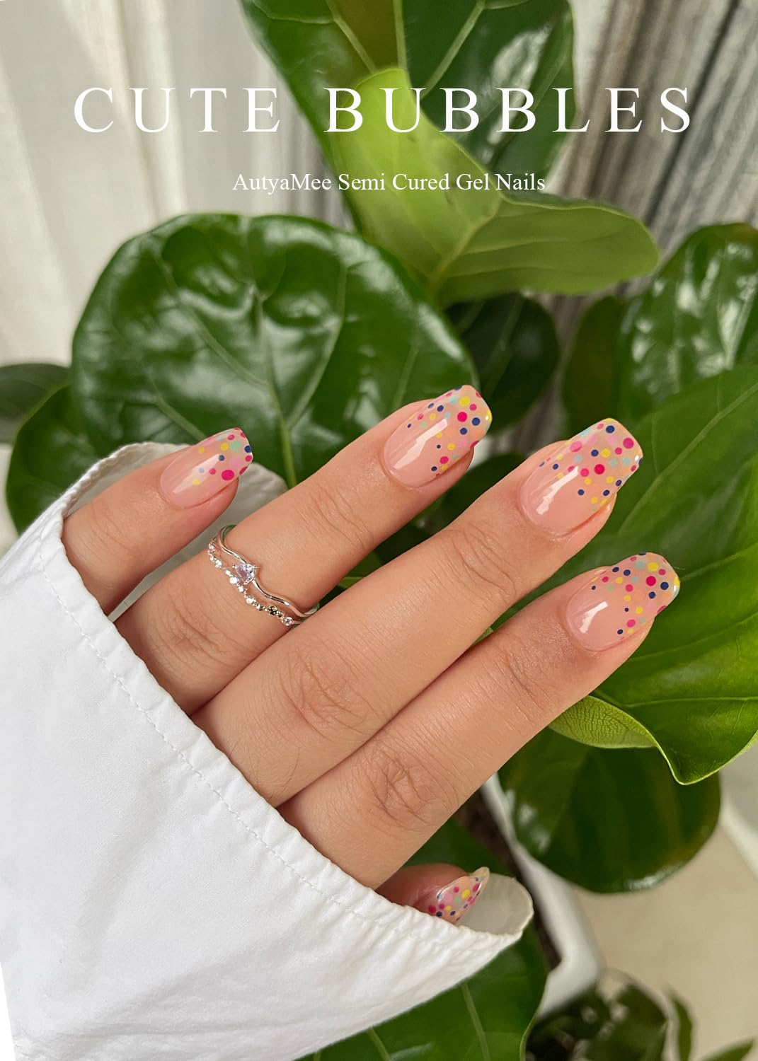 Nude pink gel nail strips with bubble design on fingernails