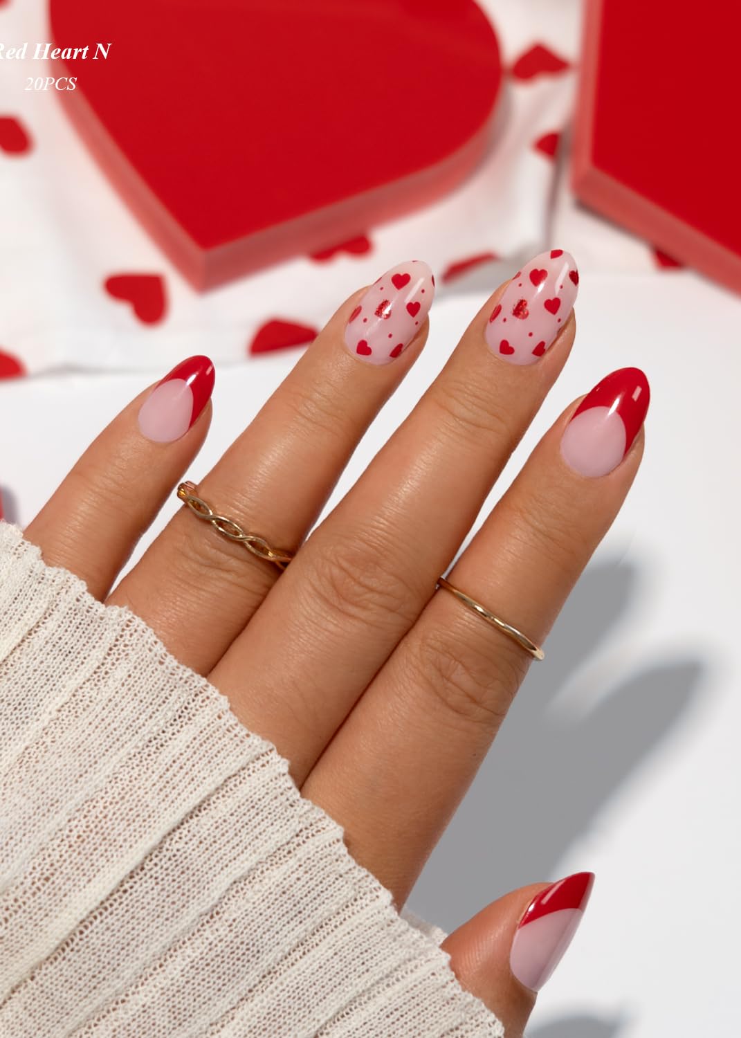 Close up of Red Heart French tip gel nail wrap design
