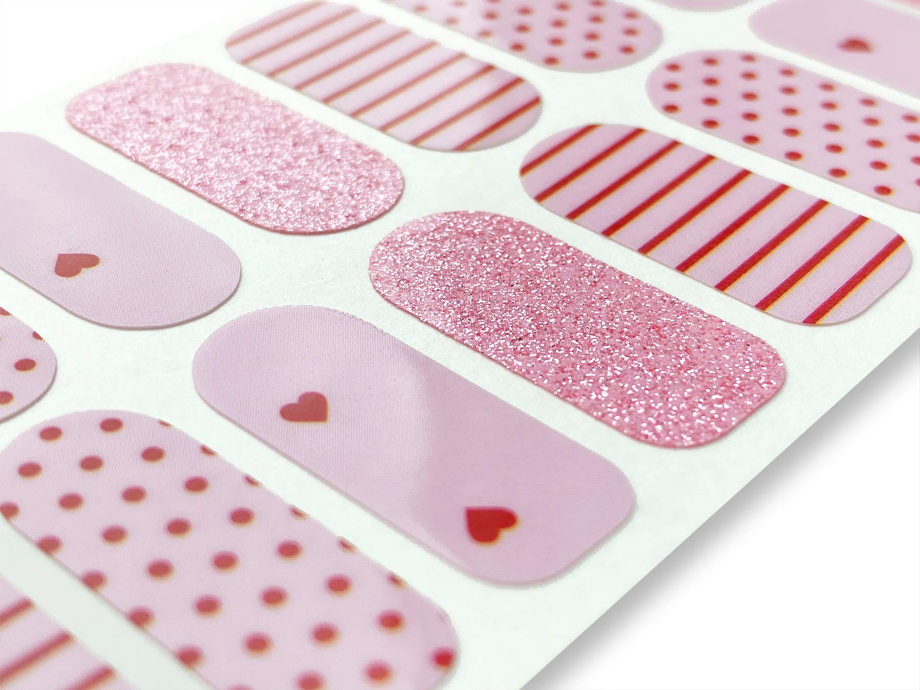 Close up view of Tough Girls hearts and lines nail art strips