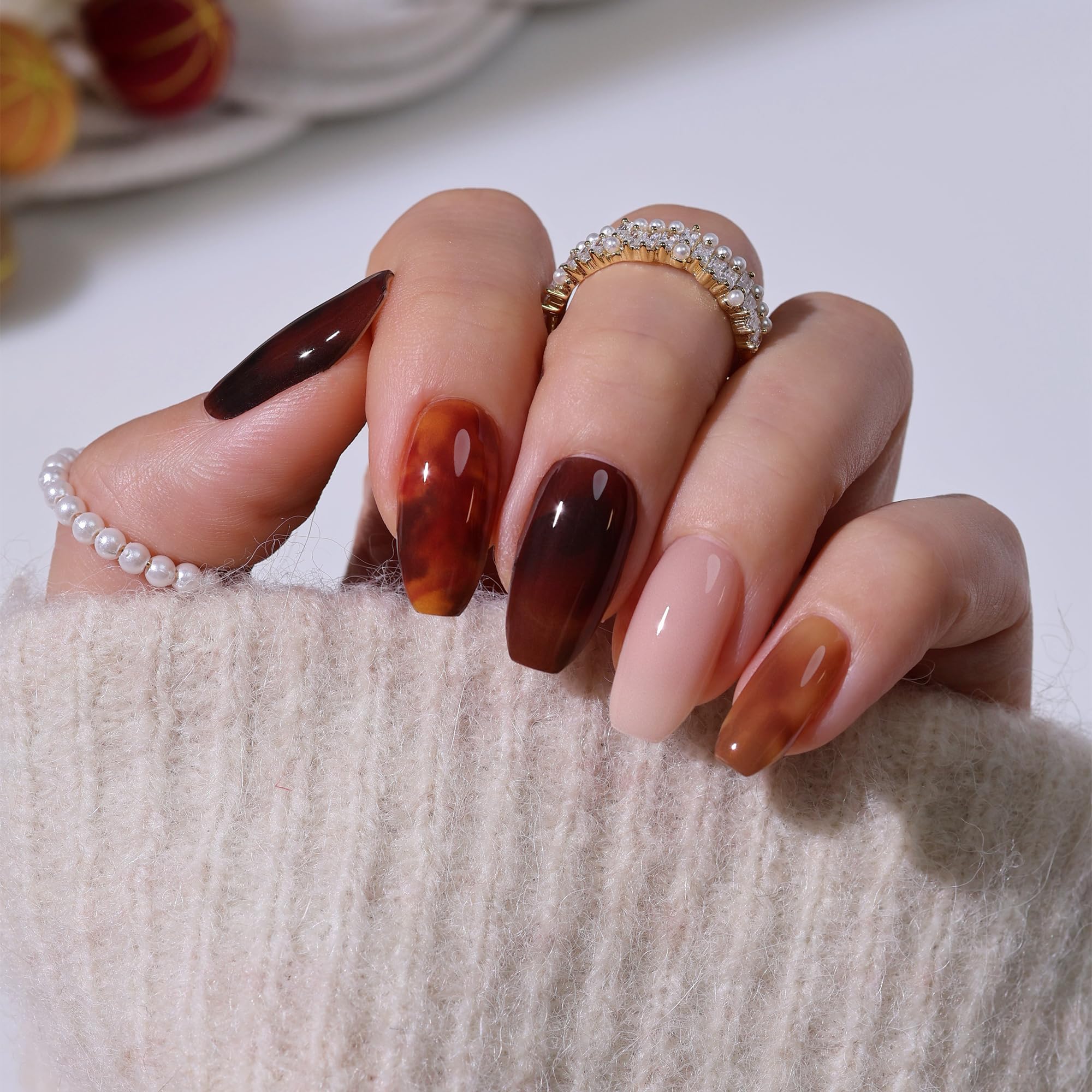 Close up of Heyhae amber tortoiseshell gel nail texture