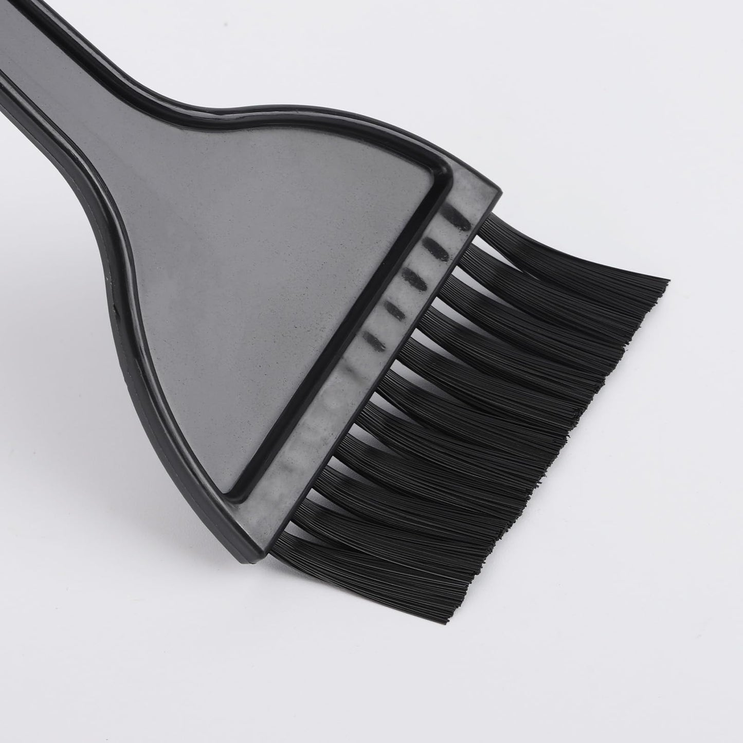 Close up of ergonomic hair dye applicator handle