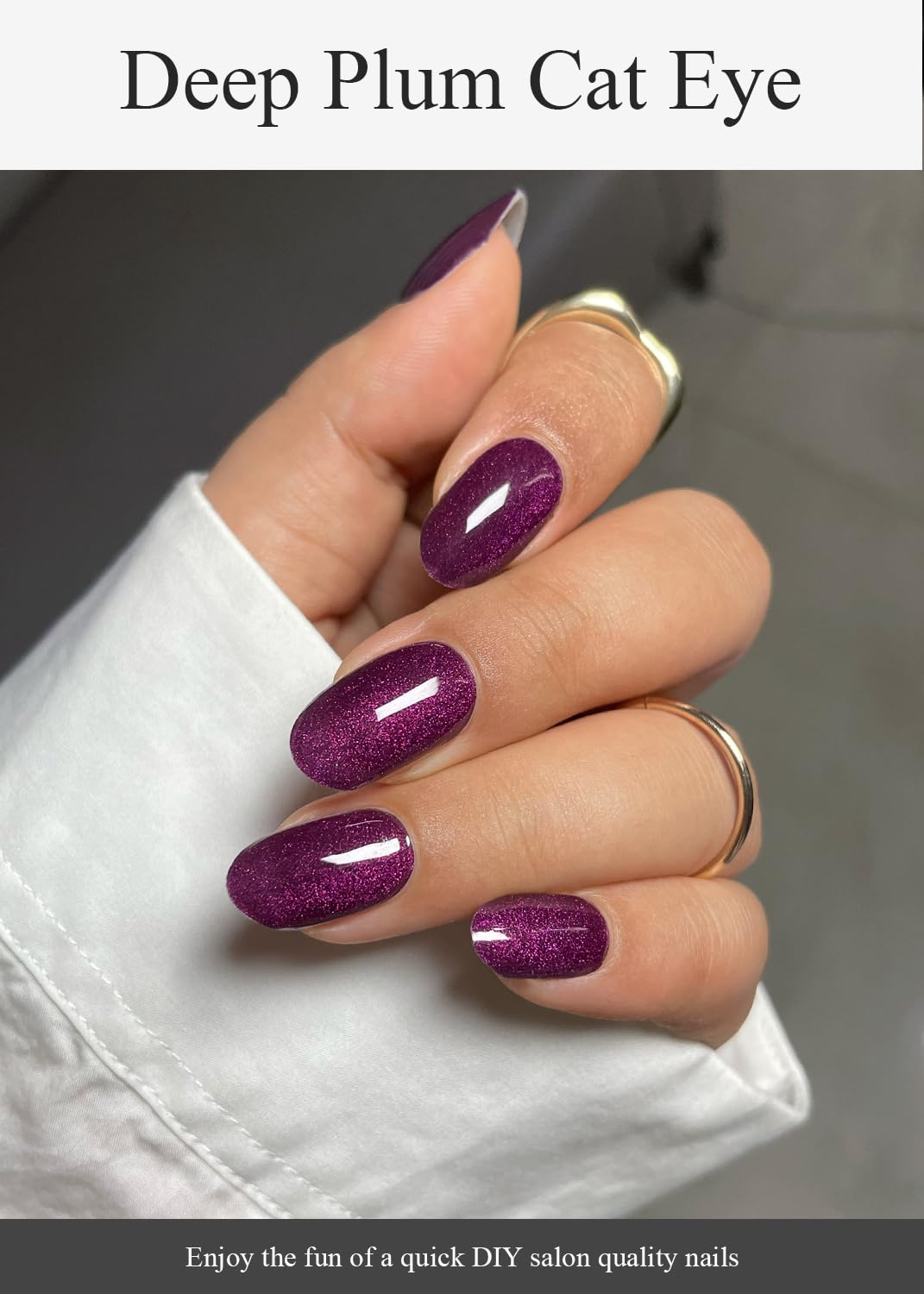 Model wearing professional salon-quality deep plum gel nails.