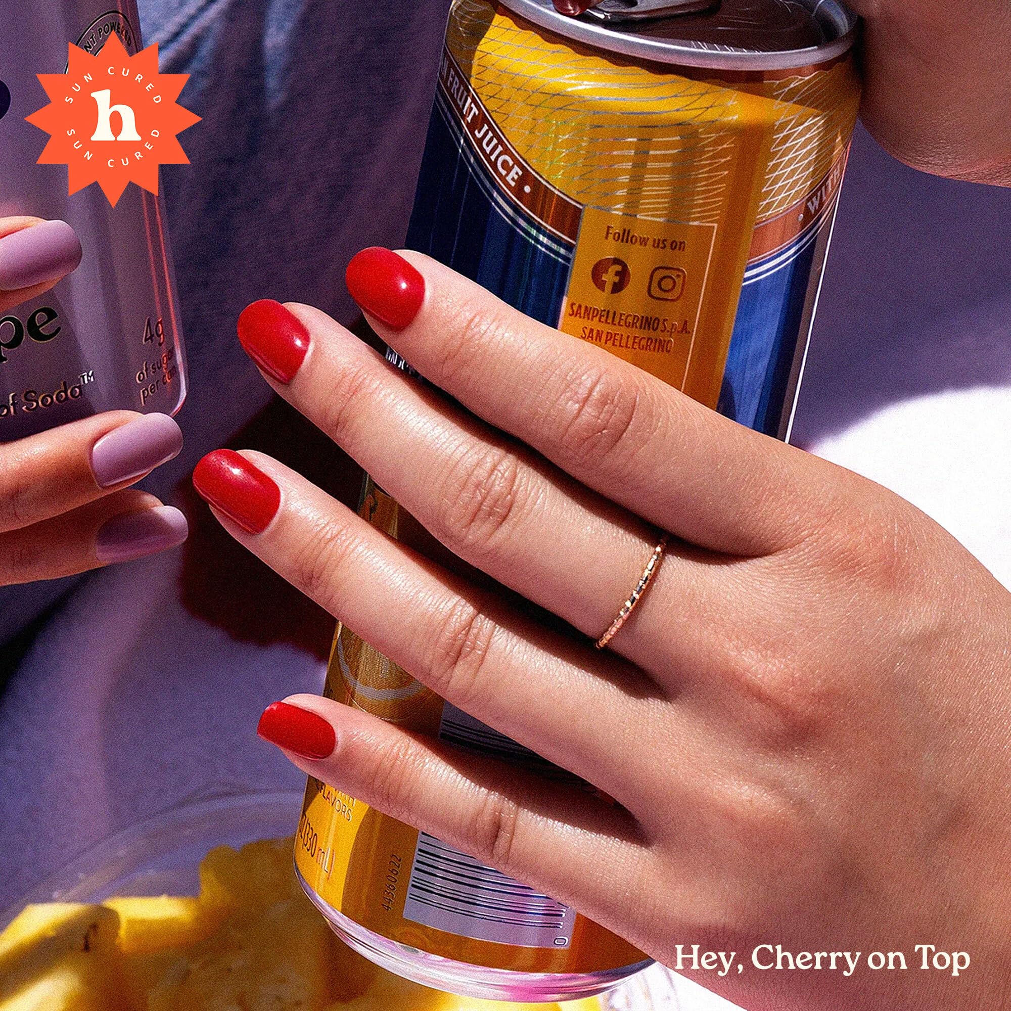 Close up of Heyhae Cherry On Top red gel nail strips on fingernails