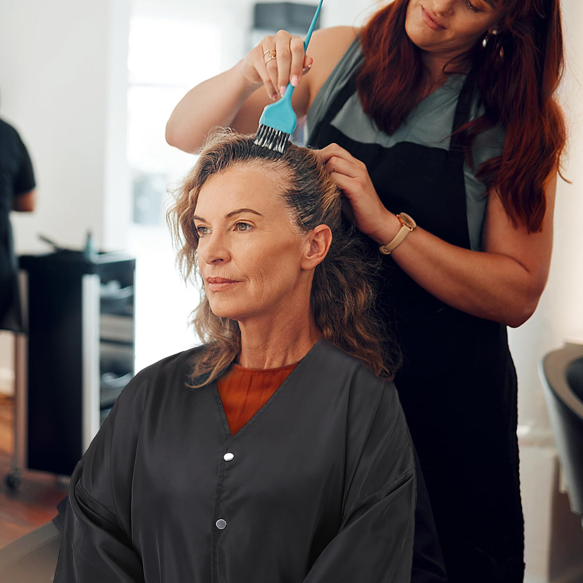 Noverlife client smock being used for professional hair coloring service