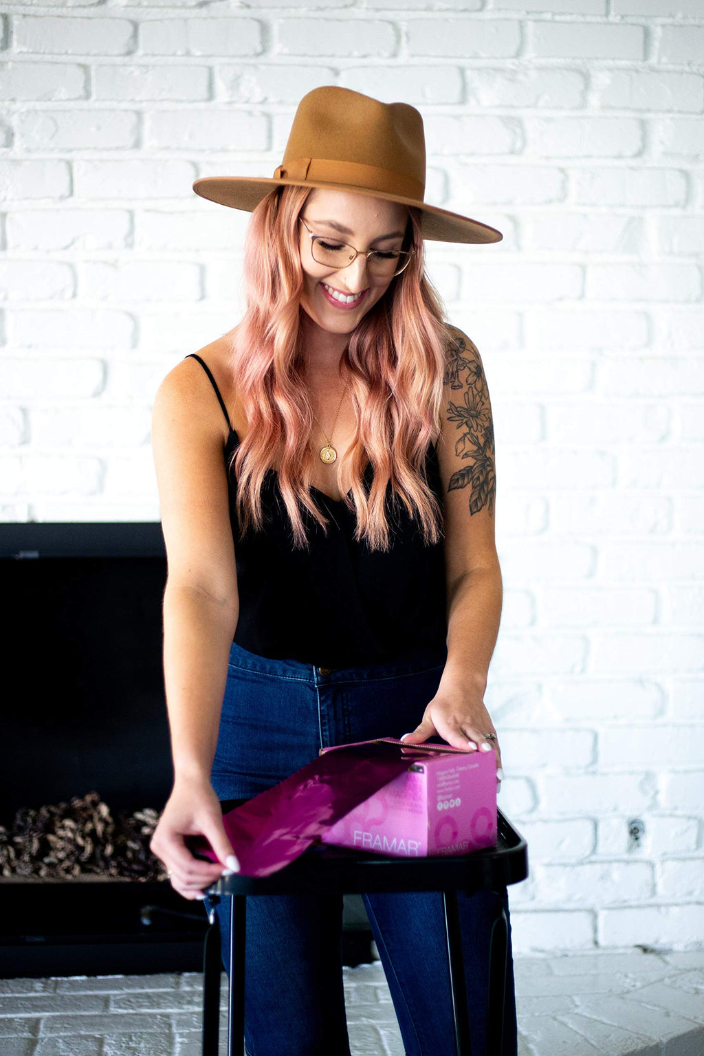 Professional hairdresser using Framar magenta foil