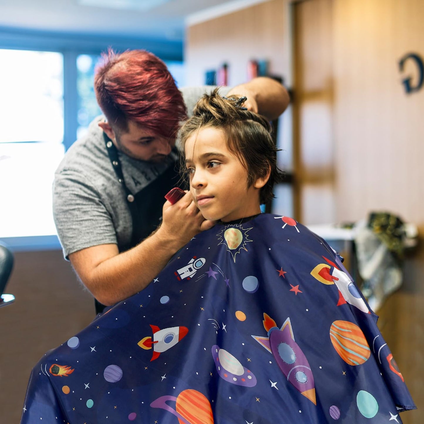 Full length view of kids hair cutting cape for salon use
