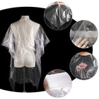 Client wearing Mihunter disposable salon cape for haircut