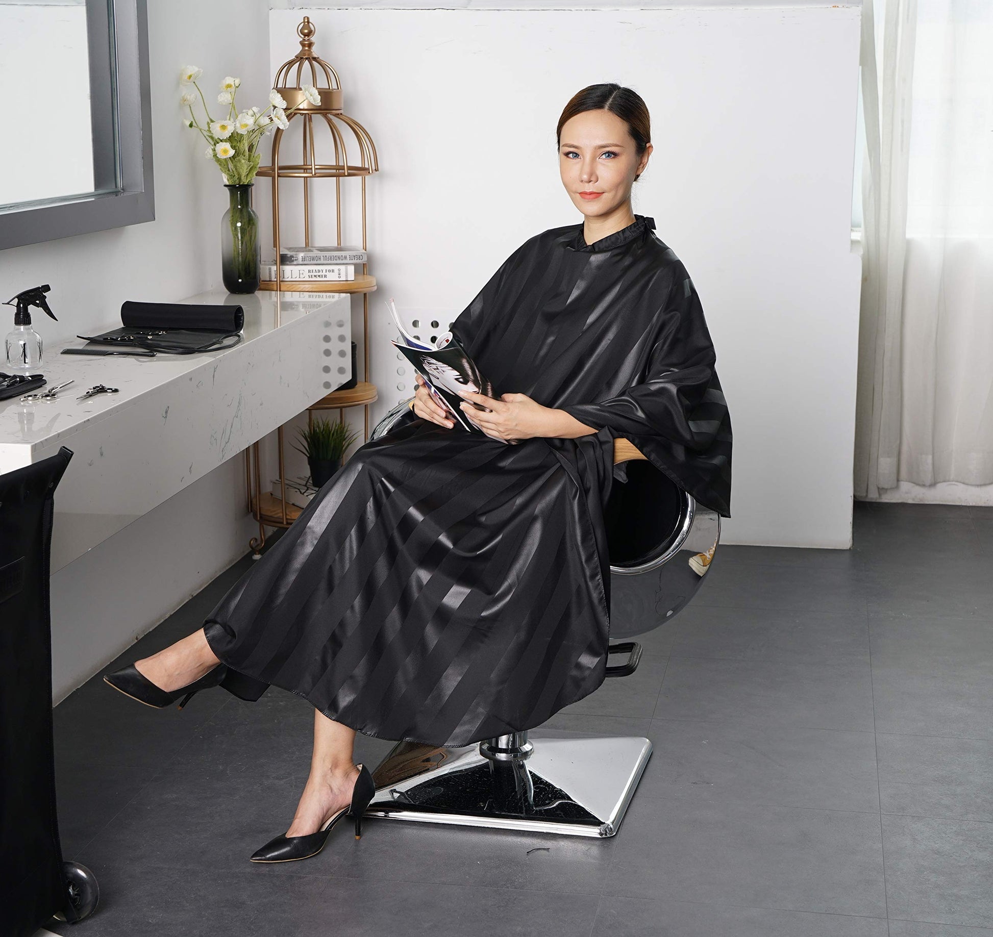 Professional barber cape worn by a model
