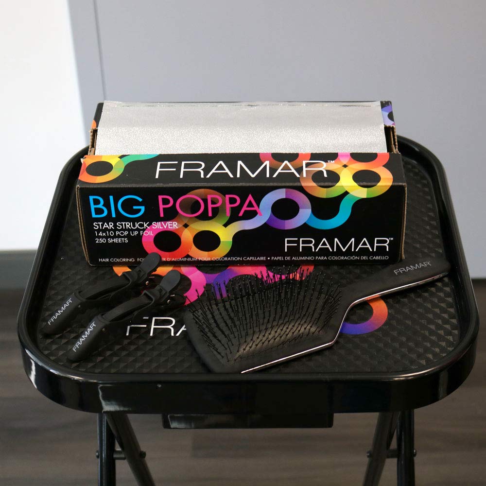 Professional stylist using Framar Big Poppa foil for highlighting