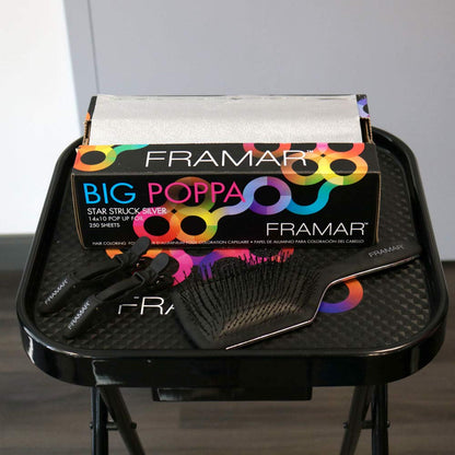 Professional stylist using Framar Big Poppa foil for highlighting