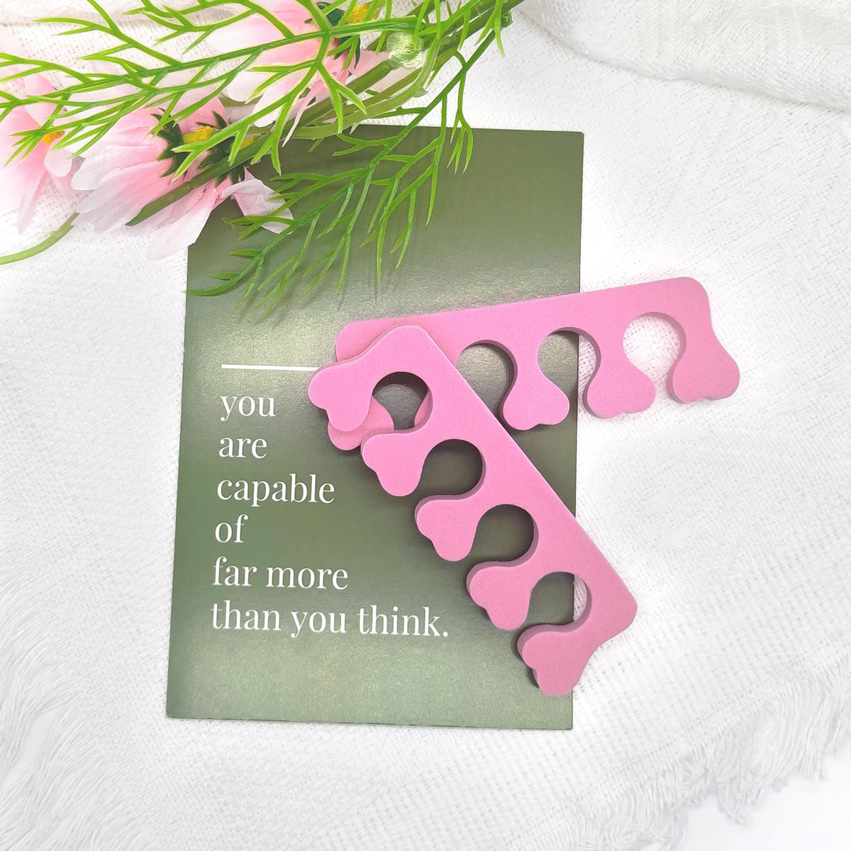 Pink sponge toe spacers for professional nail grooming