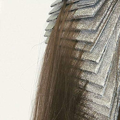 Professional hair stylist using Framar foil for highlighting