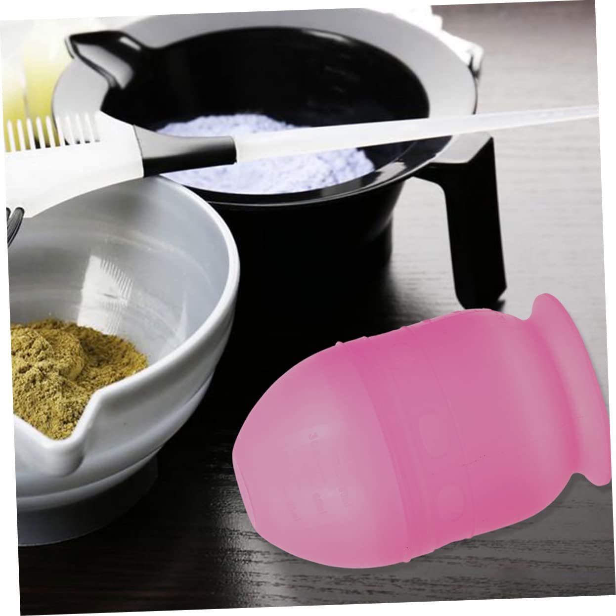 Side view of the reusable blue and pink hair coloring mixing containers