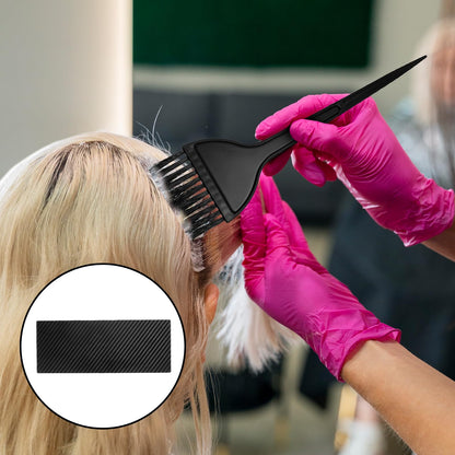 Ergonomic lightweight plastic hair coloring board demonstrating comfortable hand grip design.