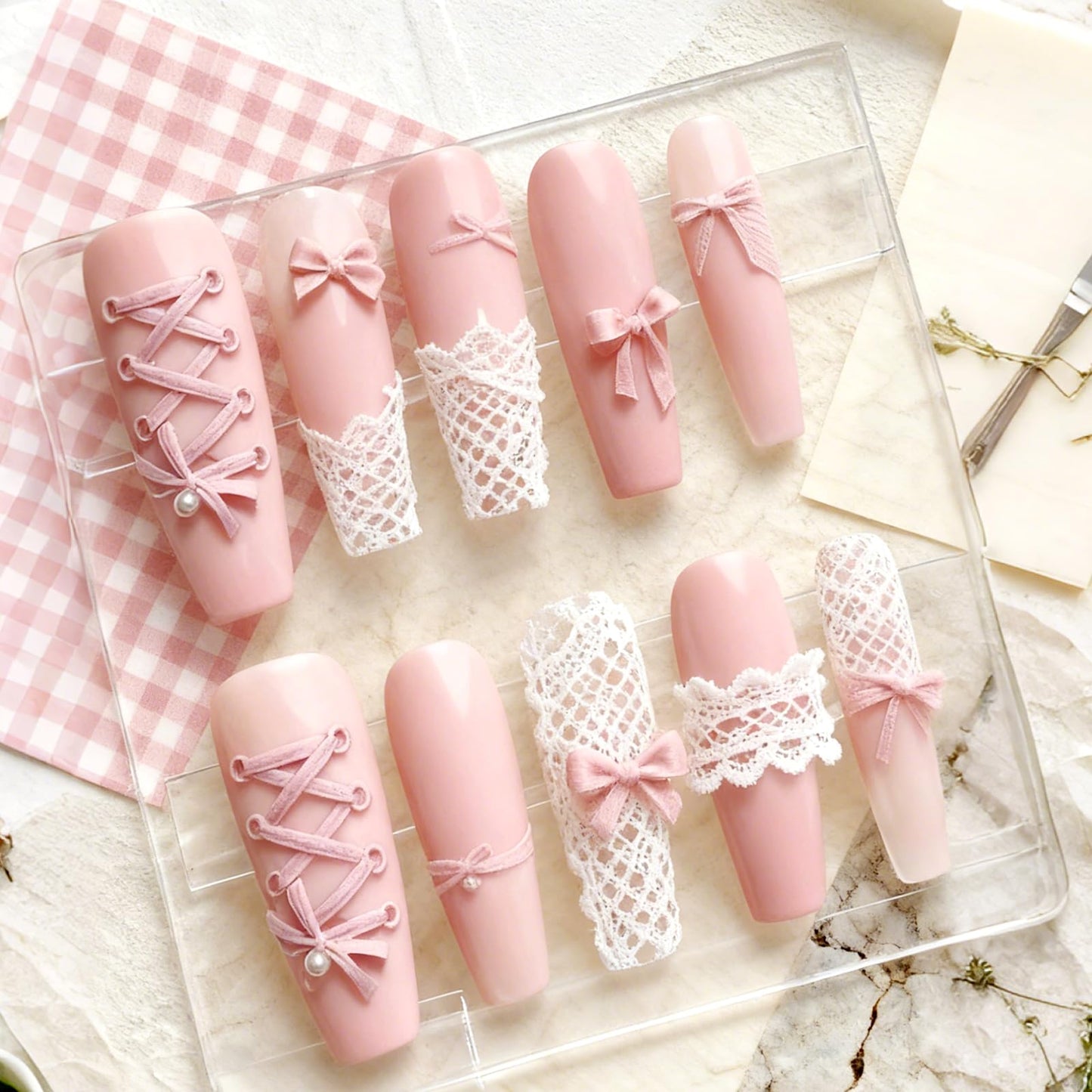 Demonstration of a flexible silicone nail mold being bent to easily release a cured 3D ribbon bow.