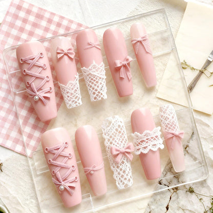 Demonstration of a flexible silicone nail mold being bent to easily release a cured 3D ribbon bow.