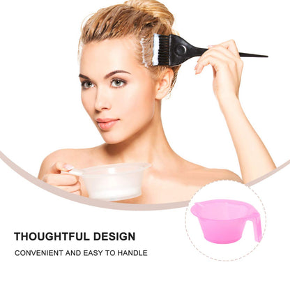 Three pink color mixing bowls spread out to highlight the uniform shape and size