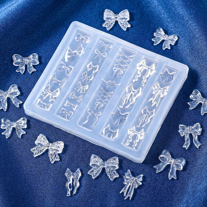 Finished 3D bow embellishments created using the Thrymme silicone carving stencil on press-on nails.