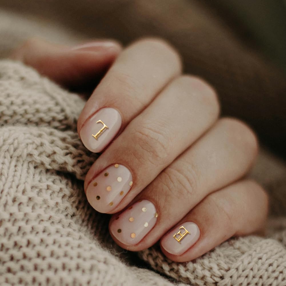 Detail of floral and number patterns on stainless steel nail plates