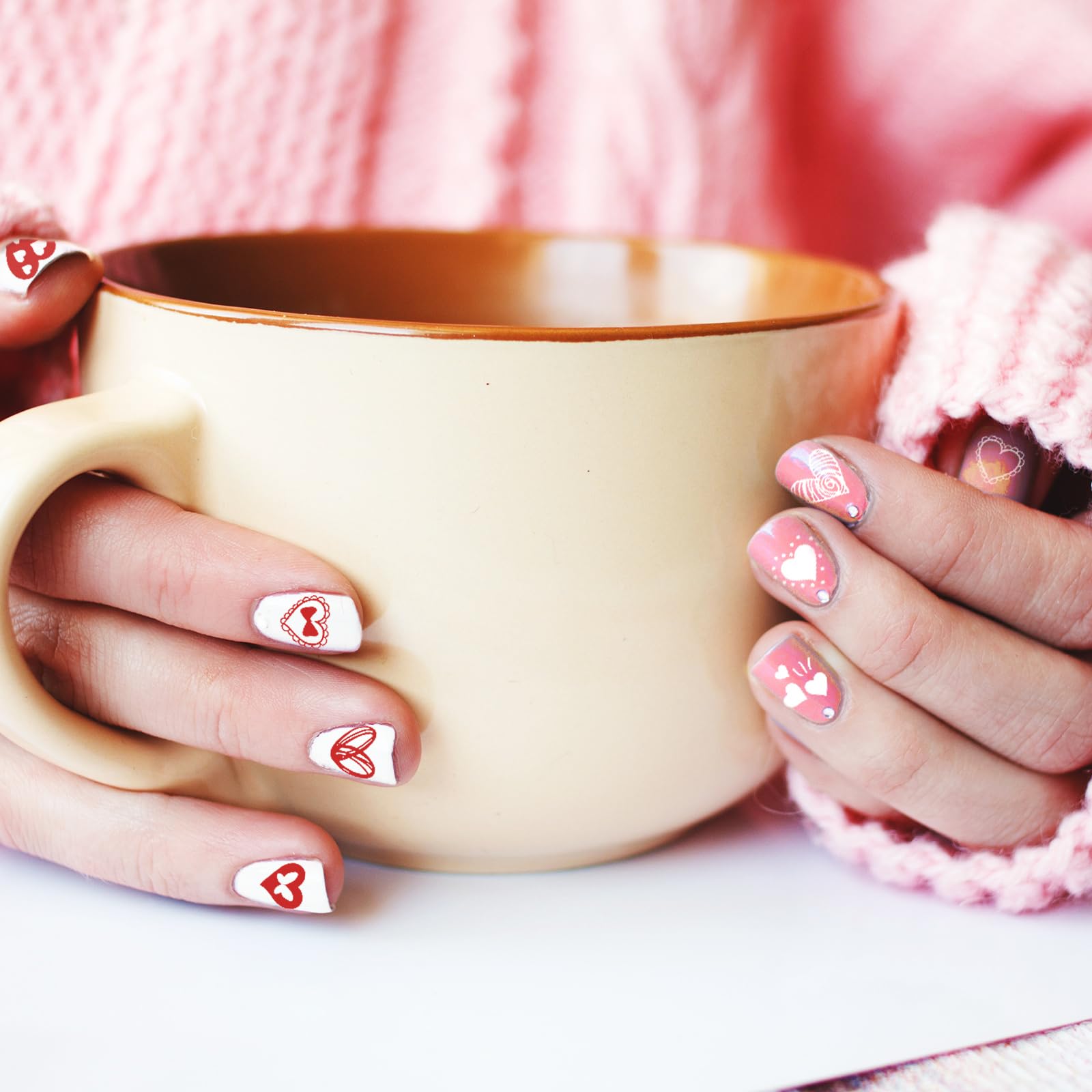 Detailed view of love letter and kiss pattern nail stamp plates