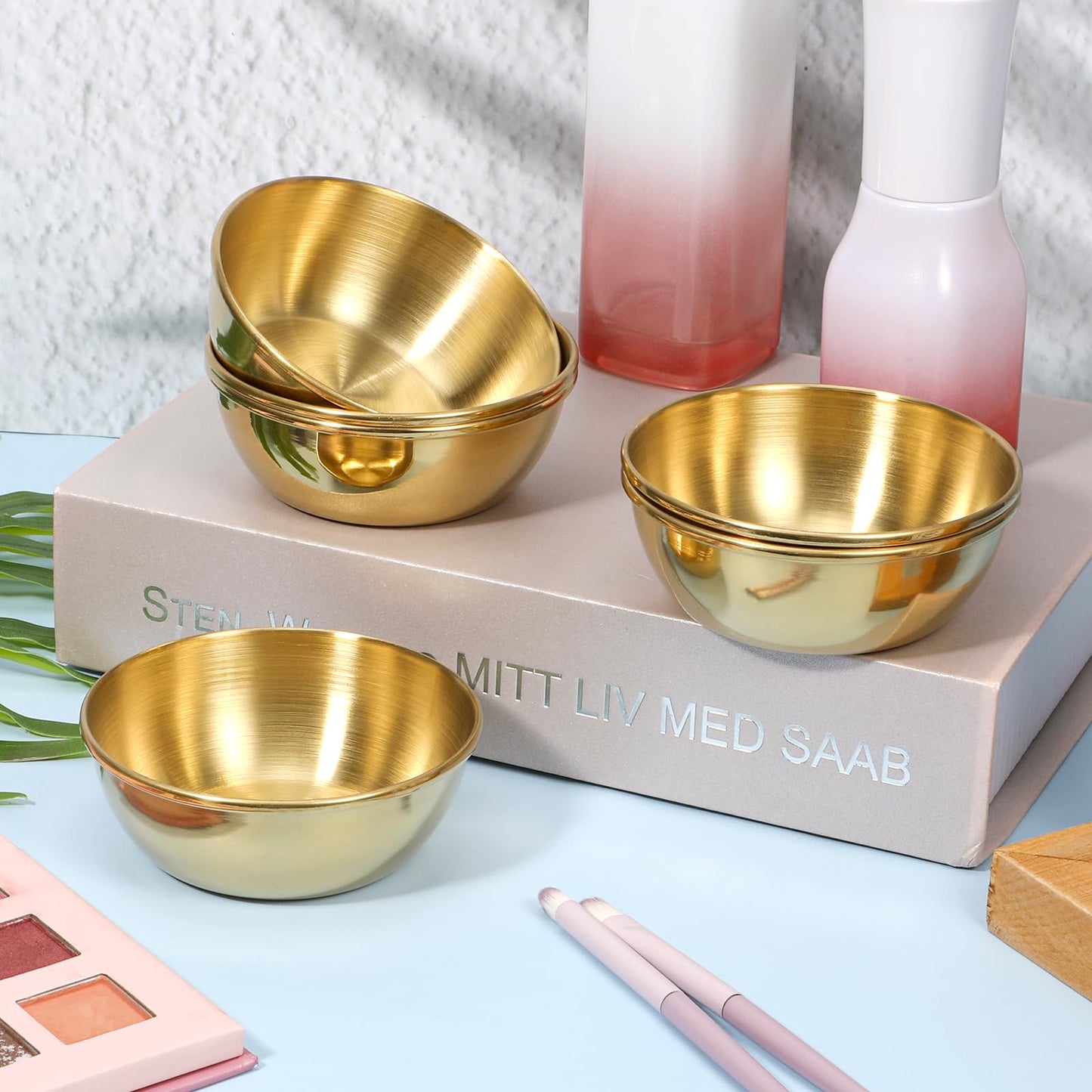 Durable and rust resistant small metallic aesthetic mixing bowls stacked together showing compact storage design.