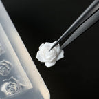Flexible silicone material of Lifoost nail carving mold being bent for easy charm removal
