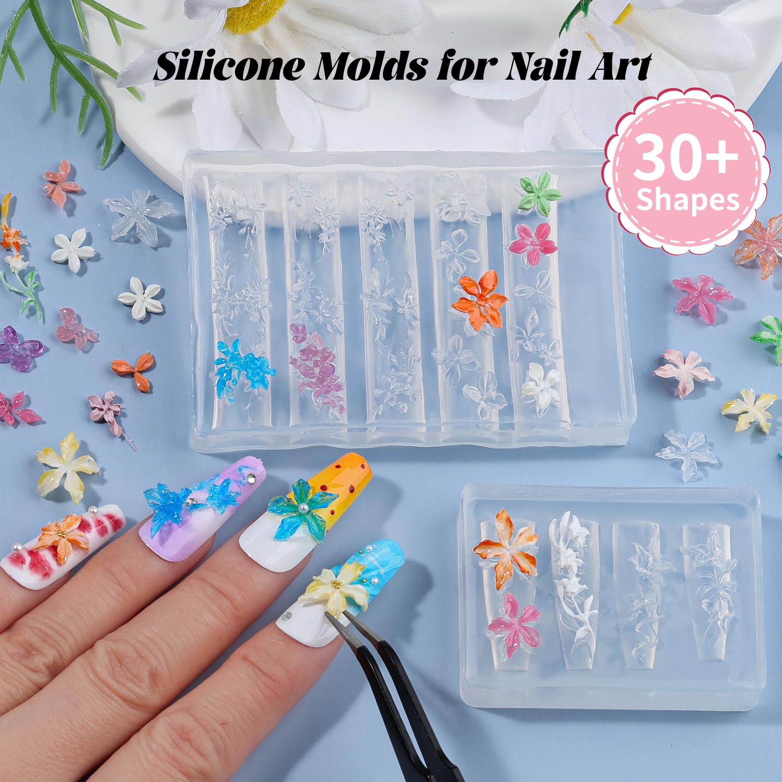 Close up of 3D hibiscus and cherry blossom patterns inside the transparent Kikonoke manicure sculpture molds.