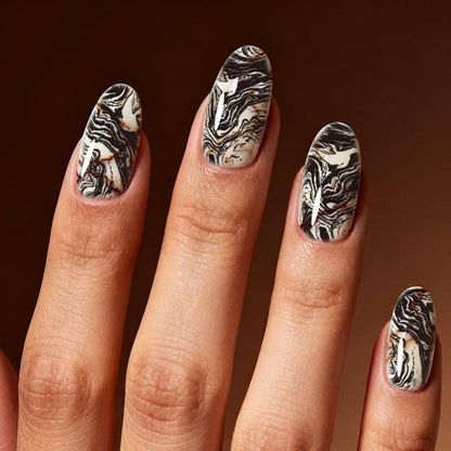 Wavy line and organic stone crack patterns on premium imported metal nail templates.