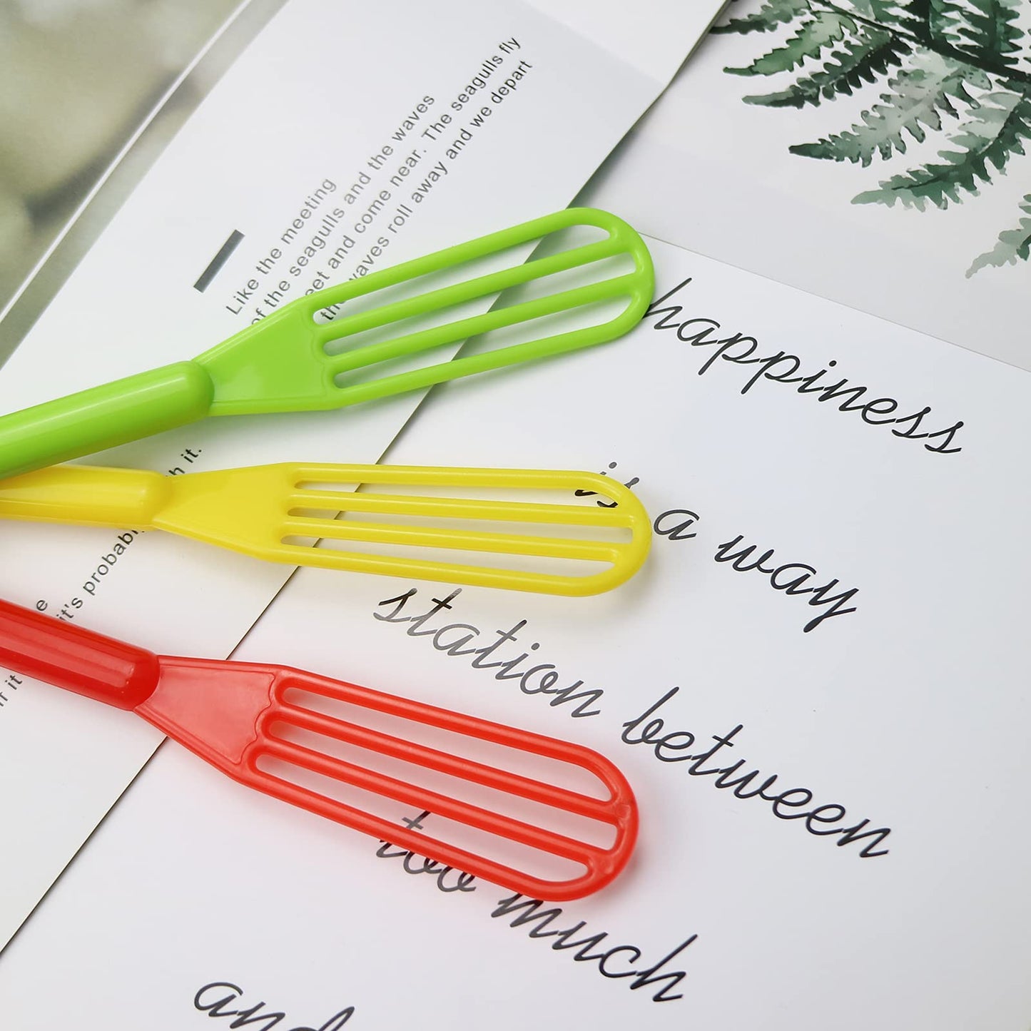 Assorted vibrant color plastic whisks for mixing hair masks