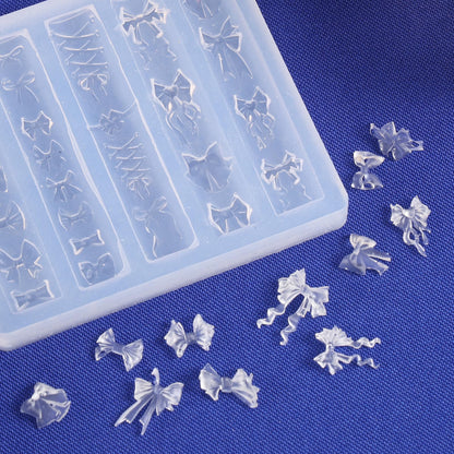Close up view of the twenty baby bow and ribbon engraving patterns on the clear stencil.