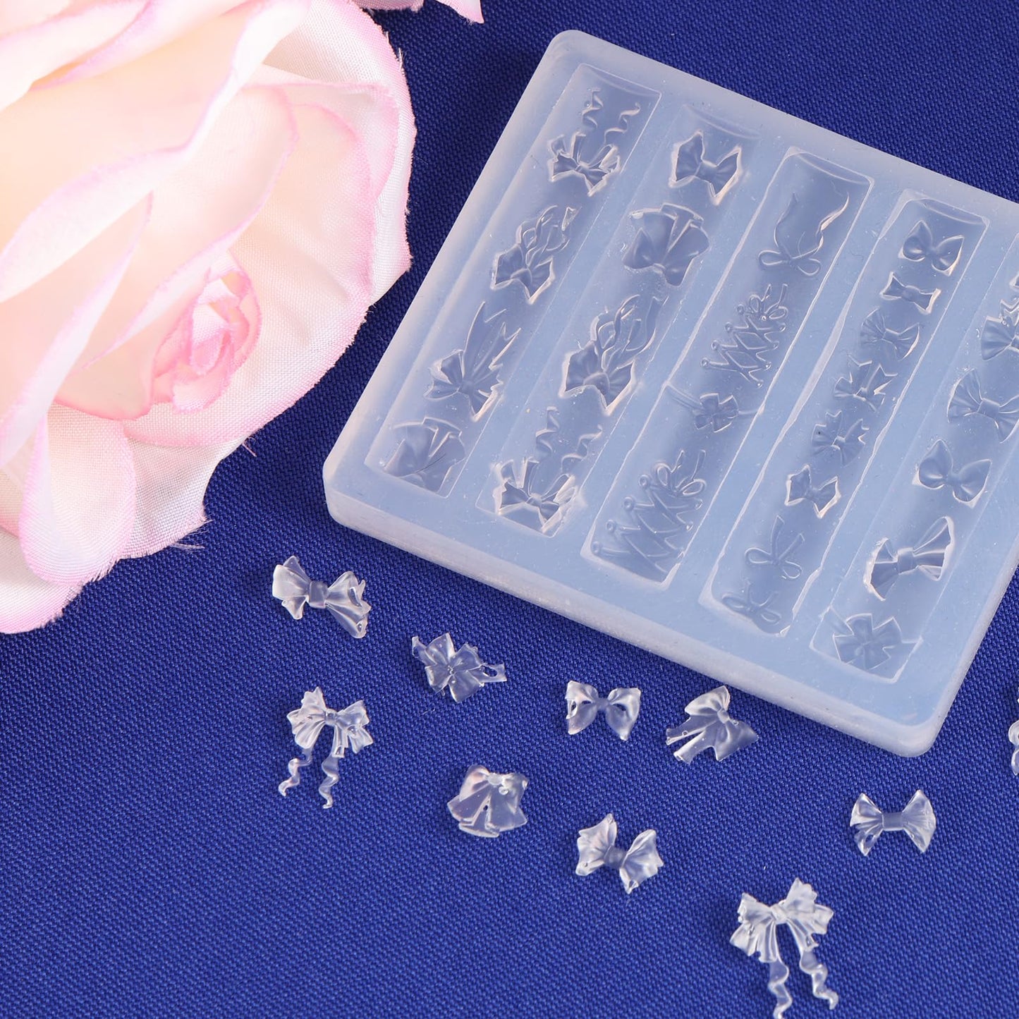 Completed fingertip art decoration featuring a custom 3D bow charm made with this mold.