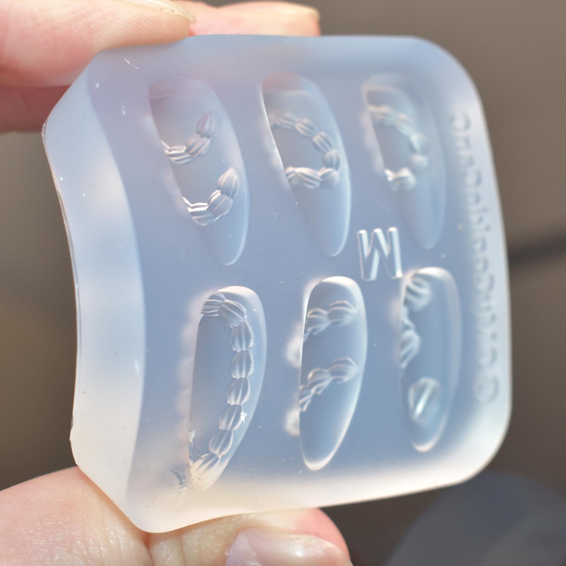 Lifoost multi pattern nail charm mold top view showcasing the exact dimensions and compact sizing.