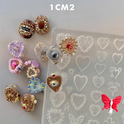 Close up of clear 3D gel nail art sculpture mold featuring European vintage baroque designs for custom resin charm creation