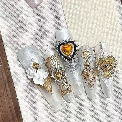 Step by step demonstration of applying the molded heart charm onto a finished extension using professional nail gel