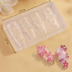 Detailed view of cherry blossom plumeria and hibiscus patterns on a clear silicone mold