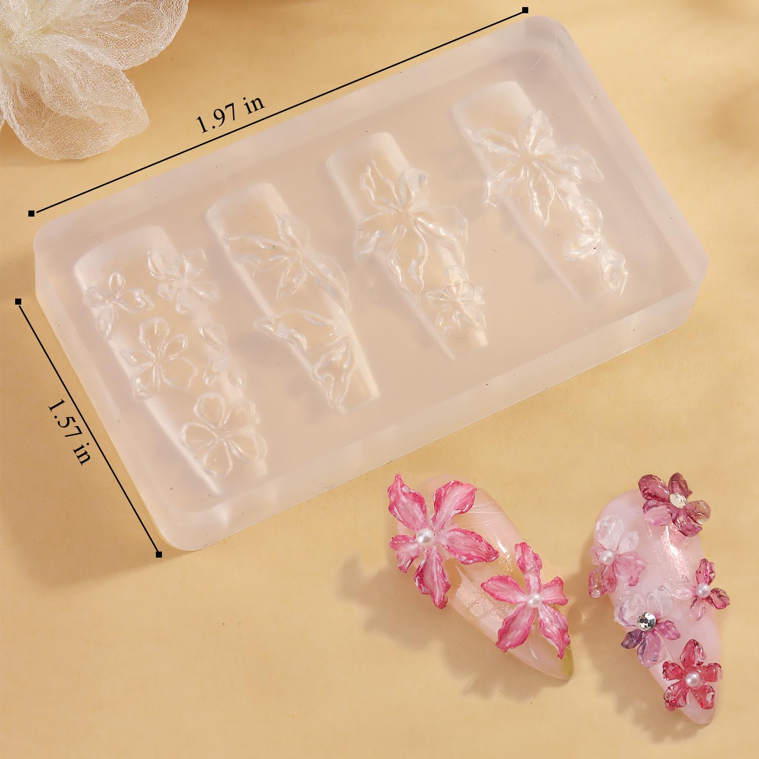 Detailed view of cherry blossom plumeria and hibiscus patterns on a clear silicone mold