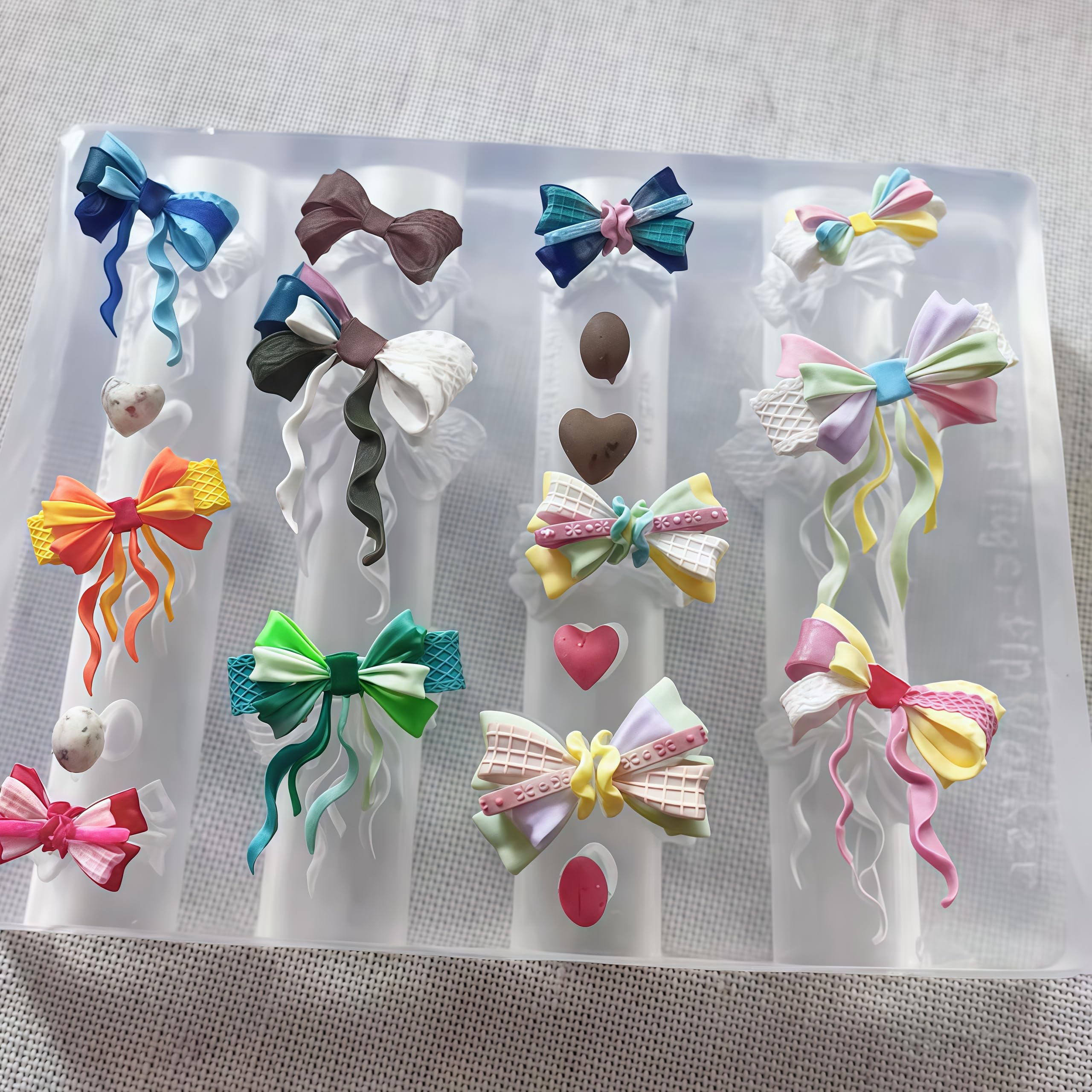 BHCCXZ silicone bowtie nails mold demonstrating flexible material bending for easy 3D charm removal.