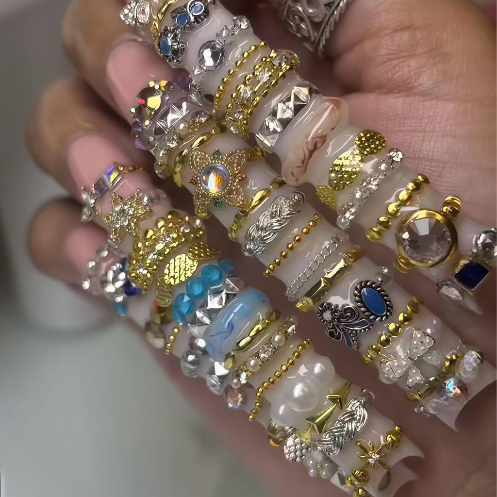 A completed winter themed manicure featuring cable knit charms created with Gehaiwo silicone tools.