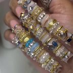 A completed winter themed manicure featuring cable knit charms created with Gehaiwo silicone tools.