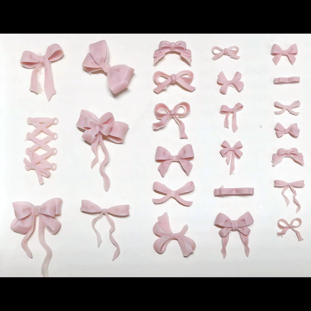A collection of colorful mini resin bow charms cast from the Zenoco multi pattern sculpture tool.