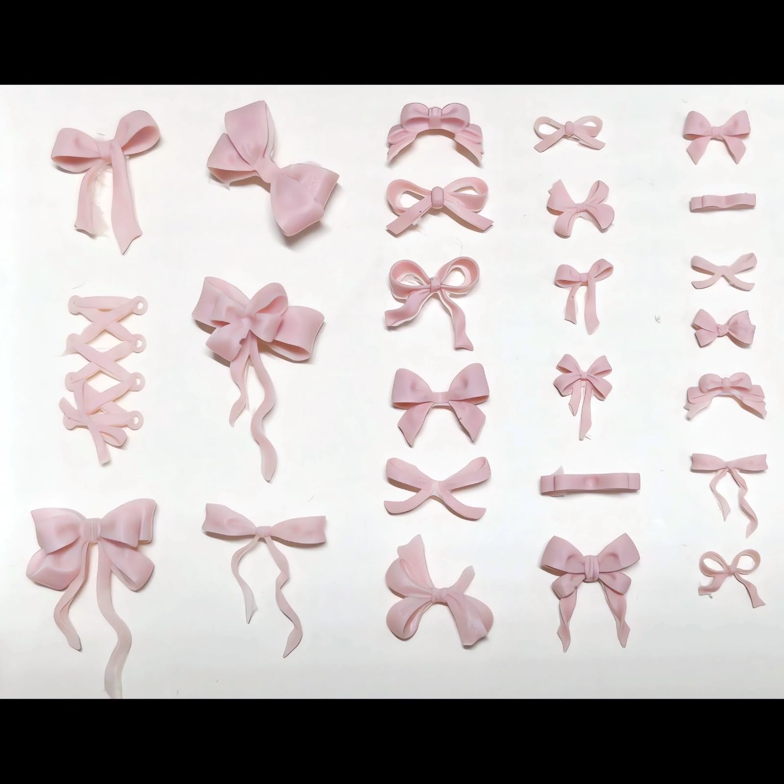 A collection of colorful mini resin bow charms cast from the Zenoco multi pattern sculpture tool.