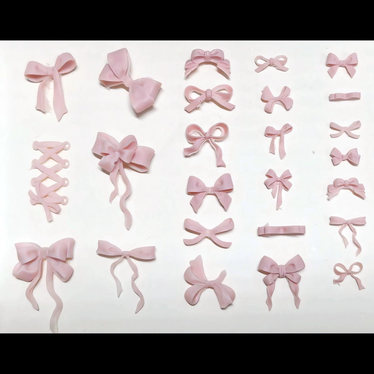 A collection of colorful mini resin bow charms cast from the Zenoco multi pattern sculpture tool.
