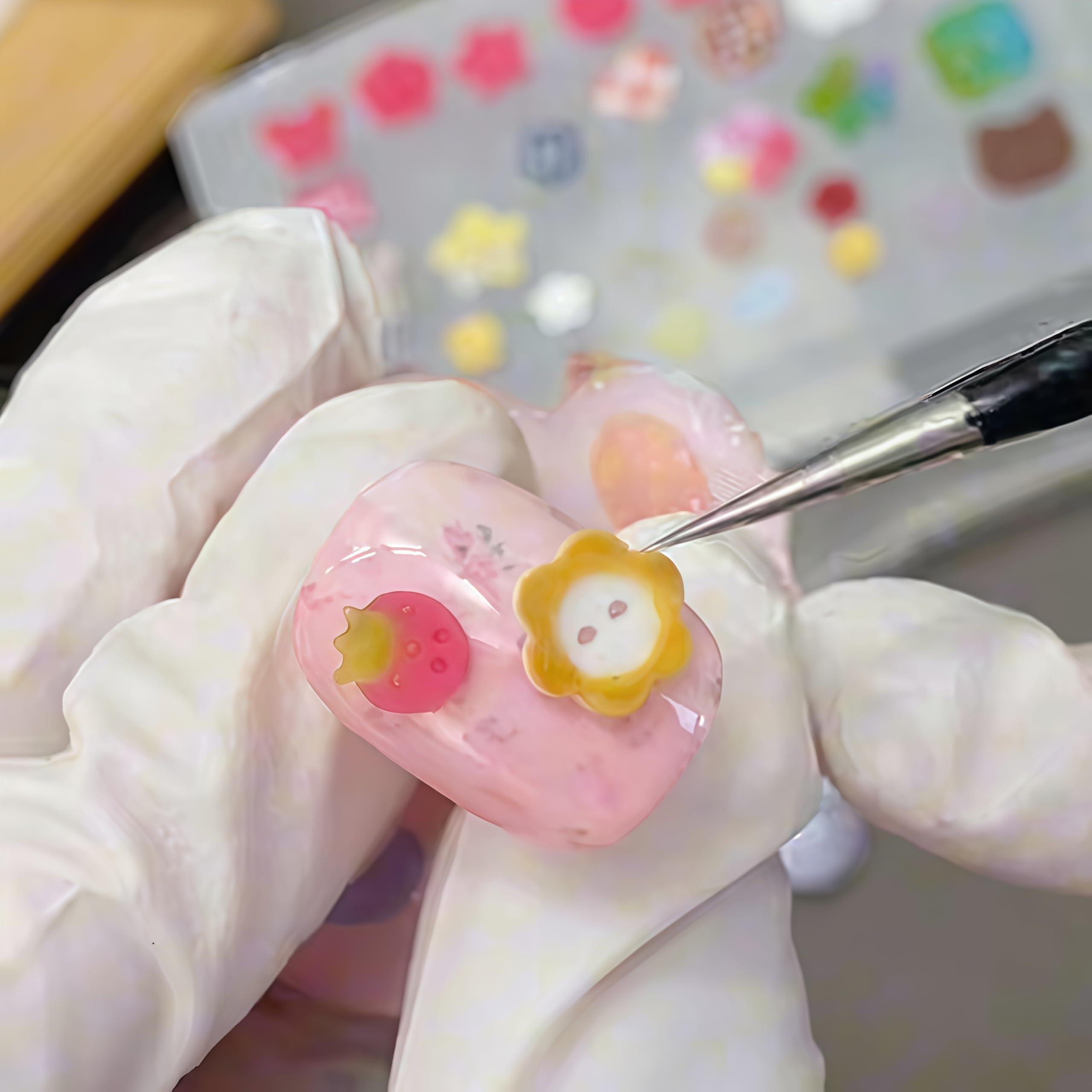 Closer view of the flexible button design resin mold for professional manicures.