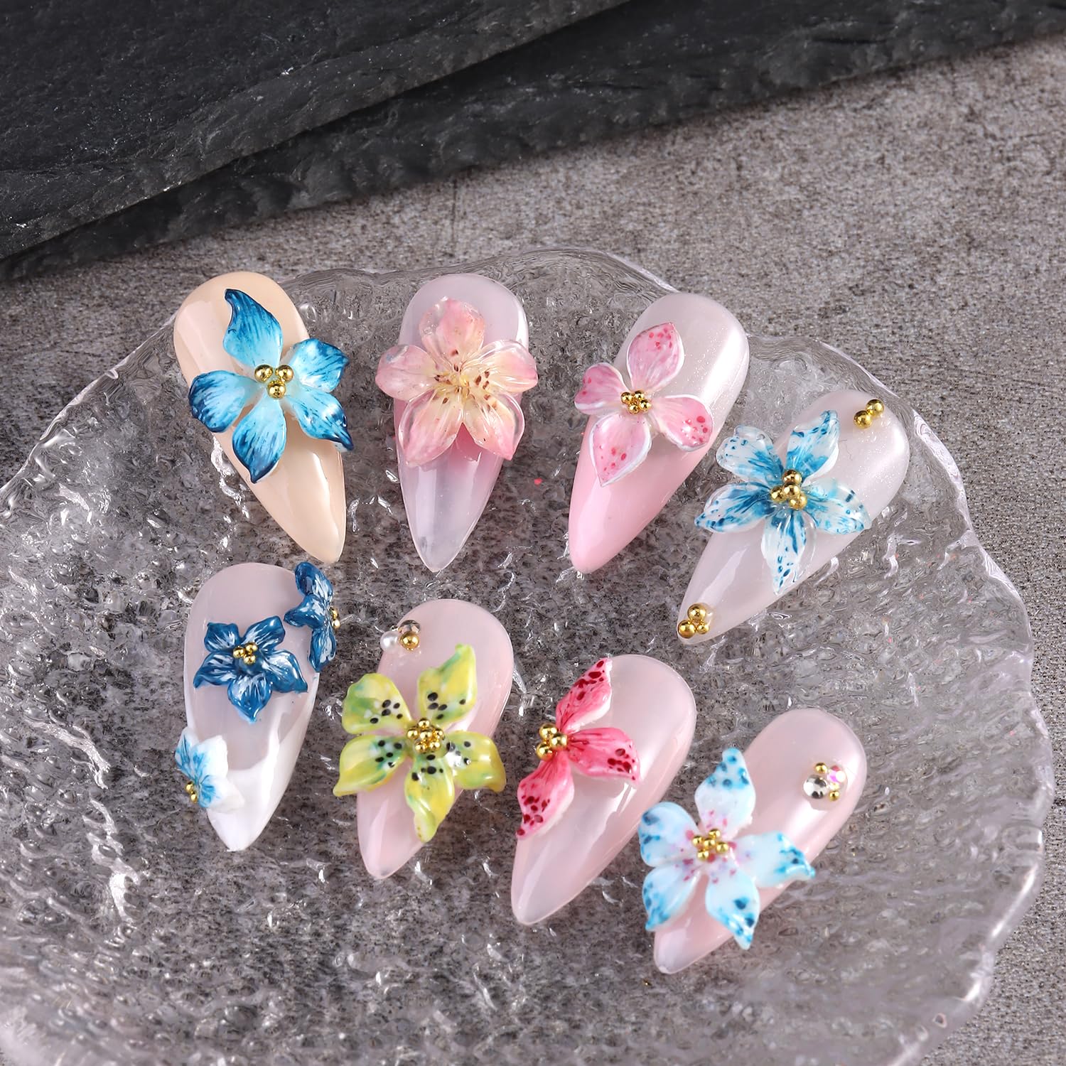 Finished 3D hibiscus flower resin charms created using the professional nail art mold