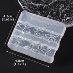 Flexible transparent silicone manicure tool being flexed to demonstrate easy demoulding