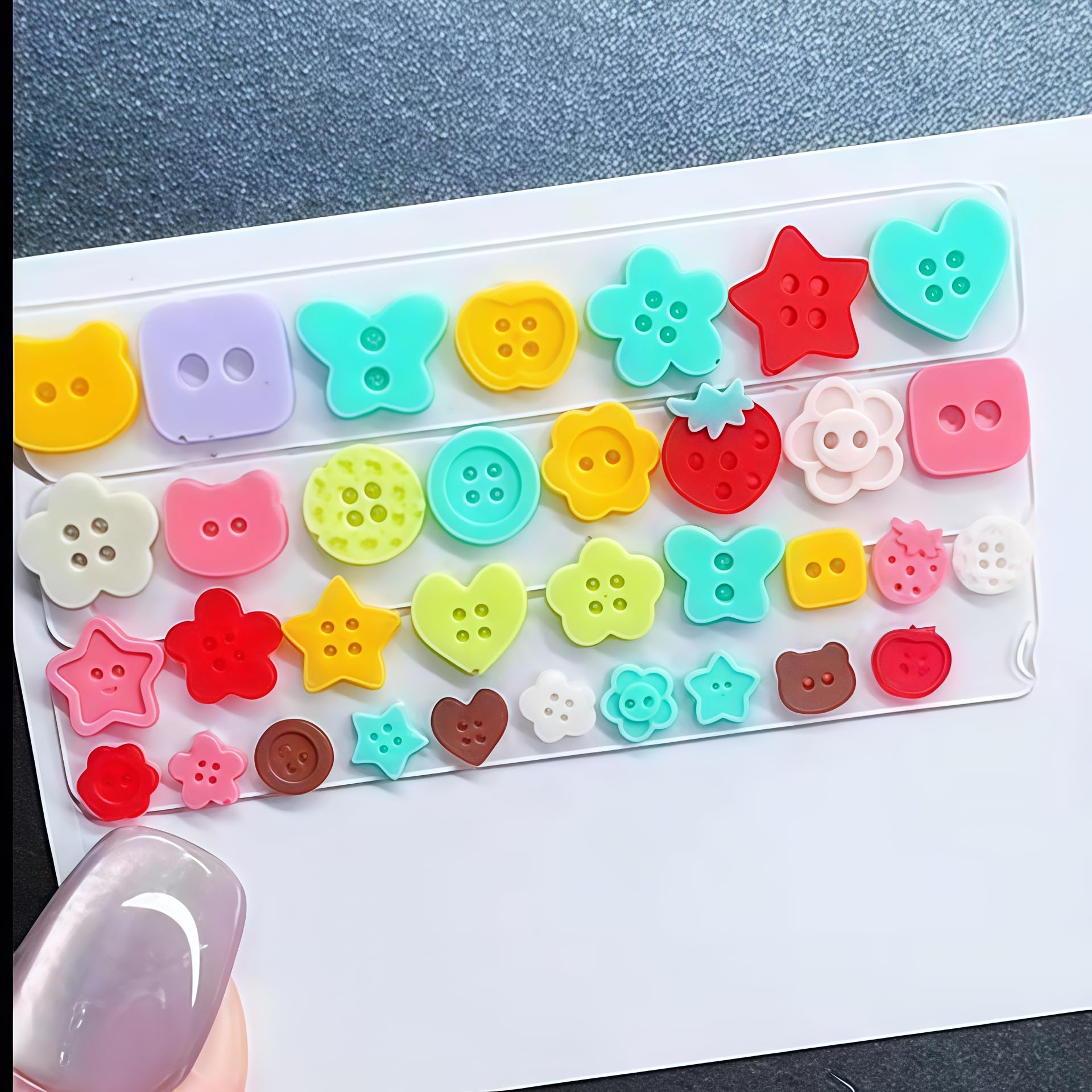 Clear silicone nail tool with button and cartoon shapes for creating 3D accents